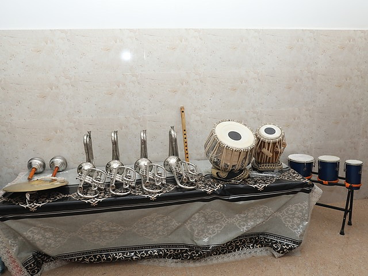 Band instruments and tabla laid out in the music room