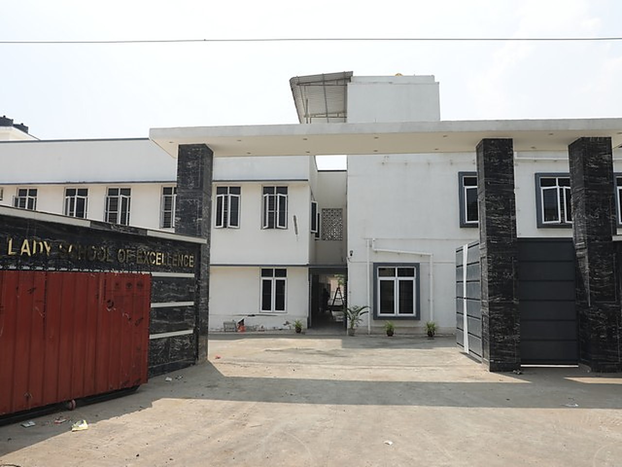 The school facade and front gate